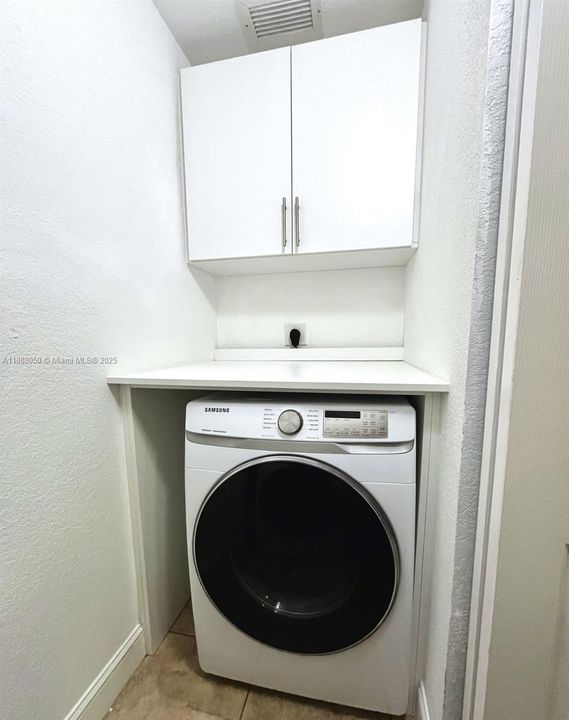 Laundry with cabinets