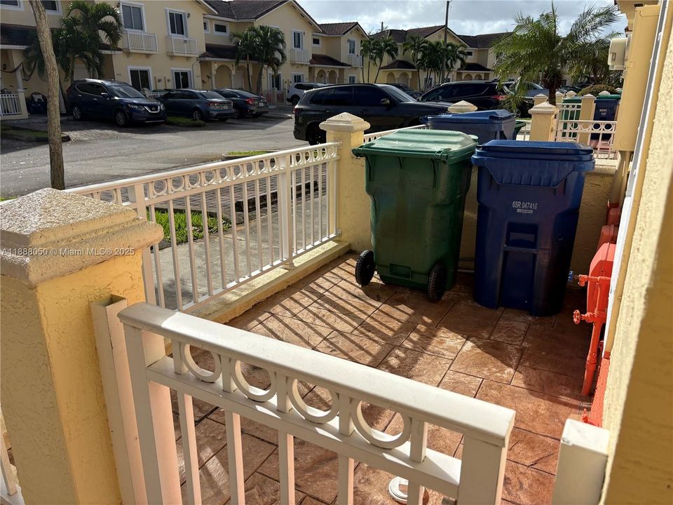 Next to parking spaces