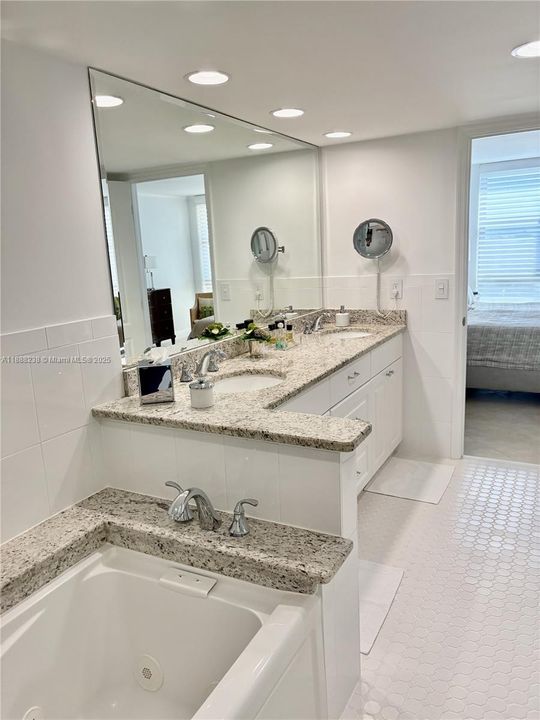 A view towards the vanity and the primary bedroom.