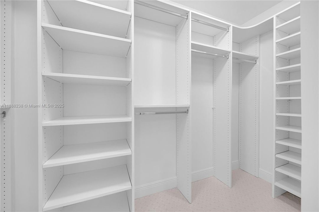 The walk-in closet is with fully installed cabinetry!