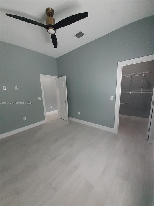 Bedroom 1 w/View to Walk-In Closet