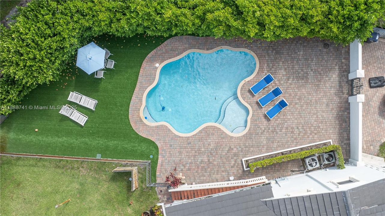 Pool area with synthetic grass.