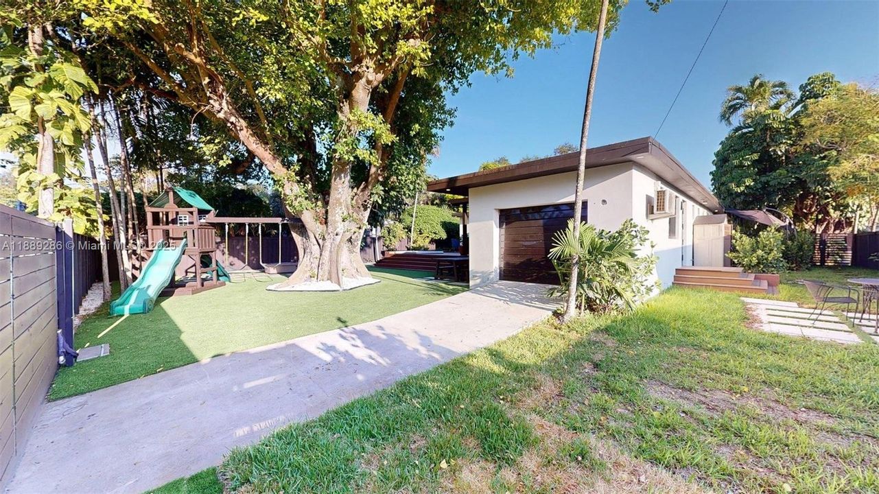 The workshop is accessible from the back alley through the motorized gate in the back of the property