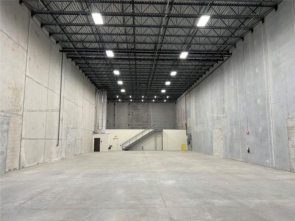 7,047 sq.ft. Warehouse Space. 32 ft. high ceilings. 2nd bathroom in the warehouse