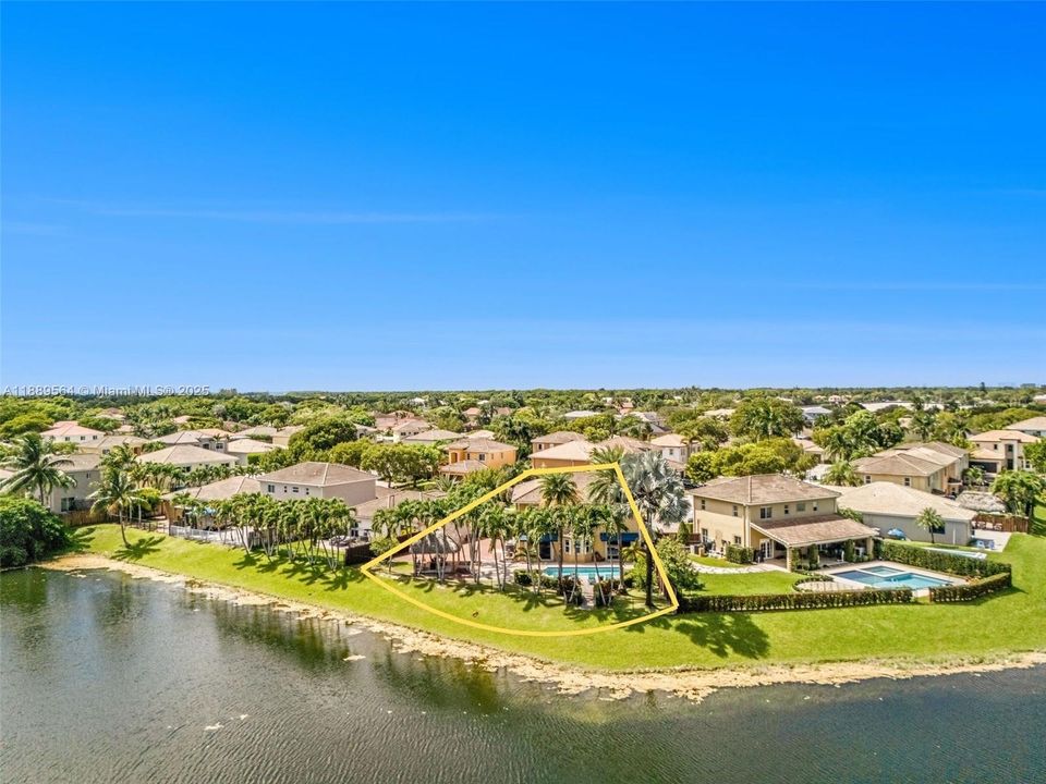 Stunning aerial view showcasing a spacious Cutler Bay home with a private pool, lush tropical landscaping, and proximity to Black Point Marina and Biscayne Bay.