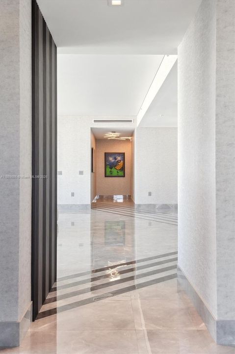 - Hallway Leading to and from the Primary Bedroom into the Open Living Area.