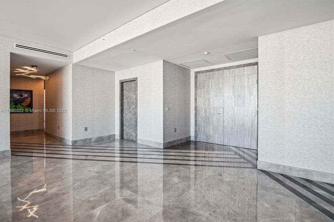 Front Entry Double Door w/ Custom Metallic Tile Finish & Porcelain Tile w/ Custom Entryway Design.