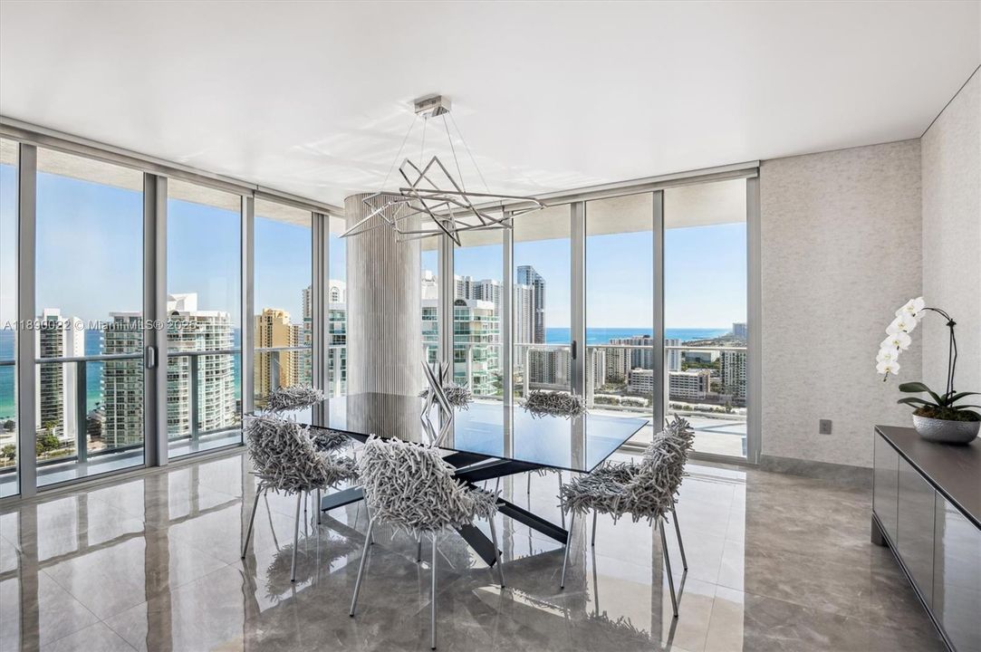 Formal Dining Area w/ Views from Every Window. Reflex Dining Table & Custom Intero Futuro Dining Chairs. Stretch Ceiling & Geometric Chandelier.