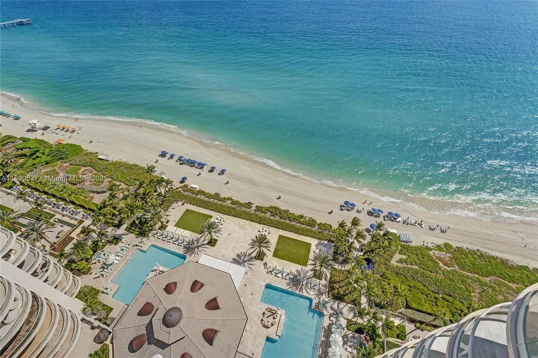 Tower sits right on the sand of Sunny Isle Beach......walk downstairs directly to the beach!