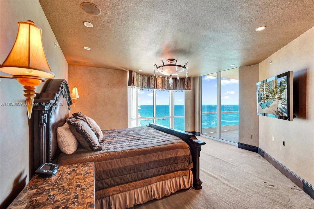 Primary bedroom with those gorgeous views of the ocean right from your bed!