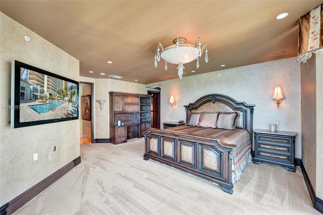 Huge primary bedroom with views of the blue ocean from the bed!