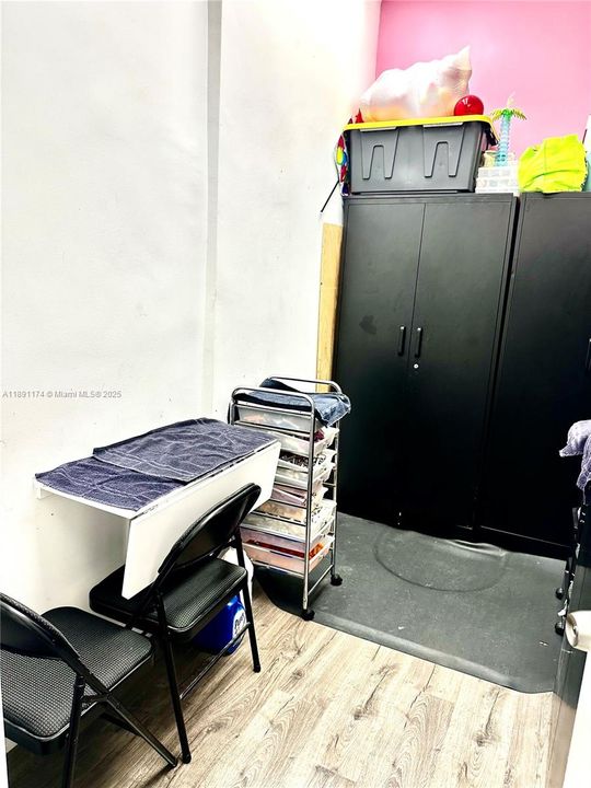 BACK ROOM, WITH STORAGE CABINETS.