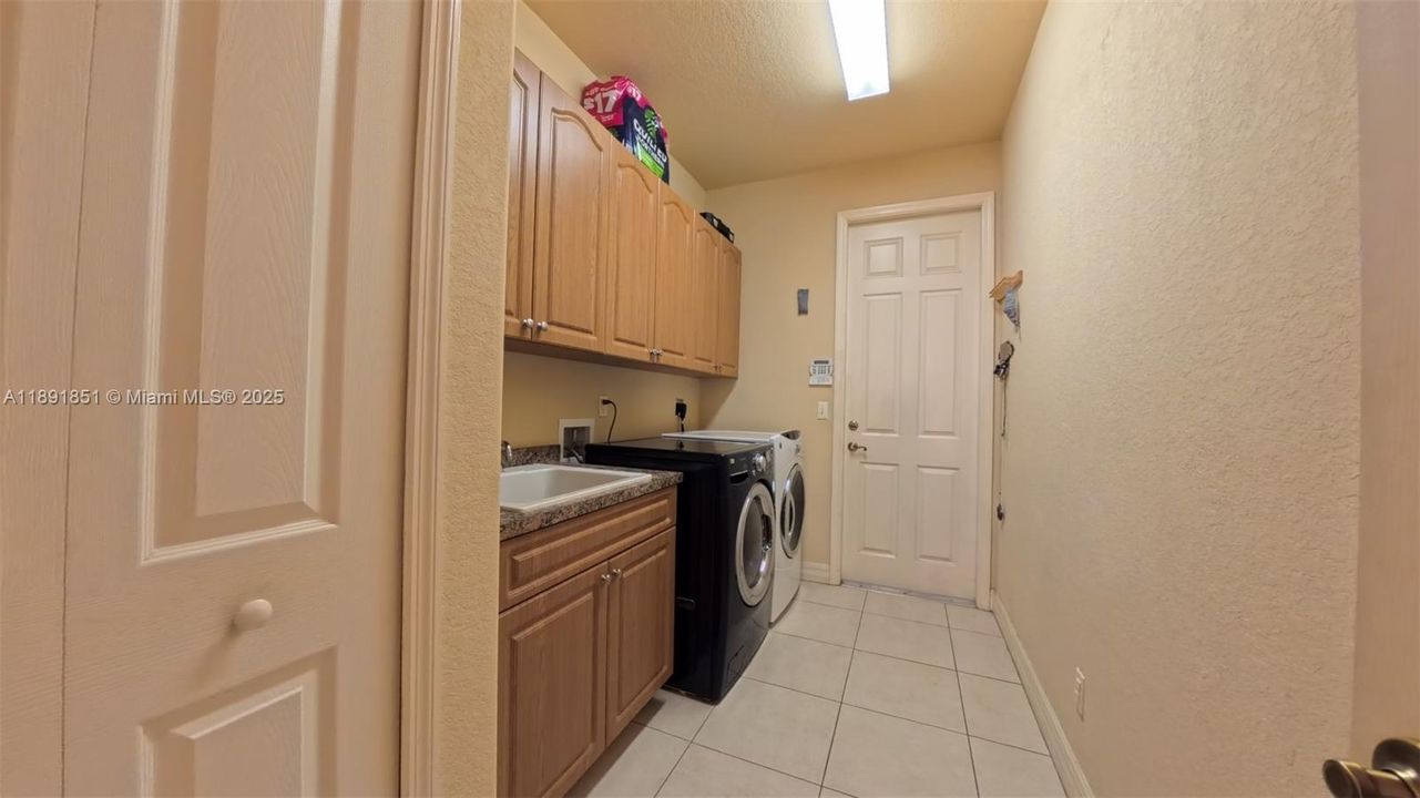 Large patio/Lanai featuring picture window style screens and concrete columns, ceiling fans, paver floor