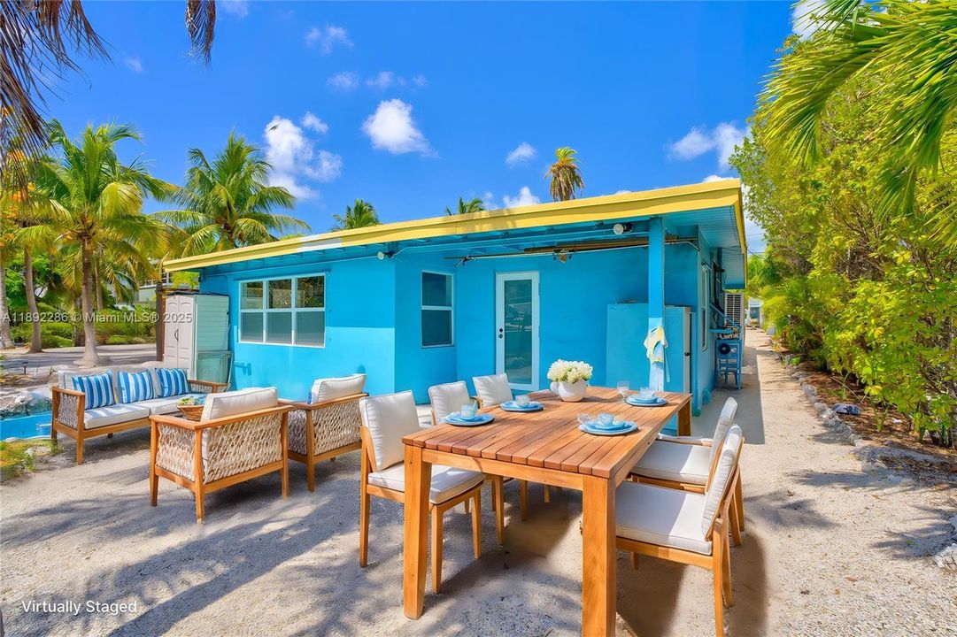 Back of super cute house virtually staged.