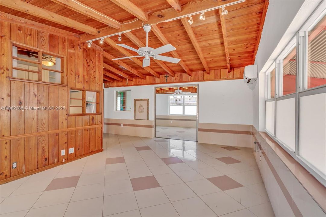 from front door. Keep the classic wood beam and panel style or paint it all white, solid tile floor is ready to throw down vinyl planks...easy makeover
