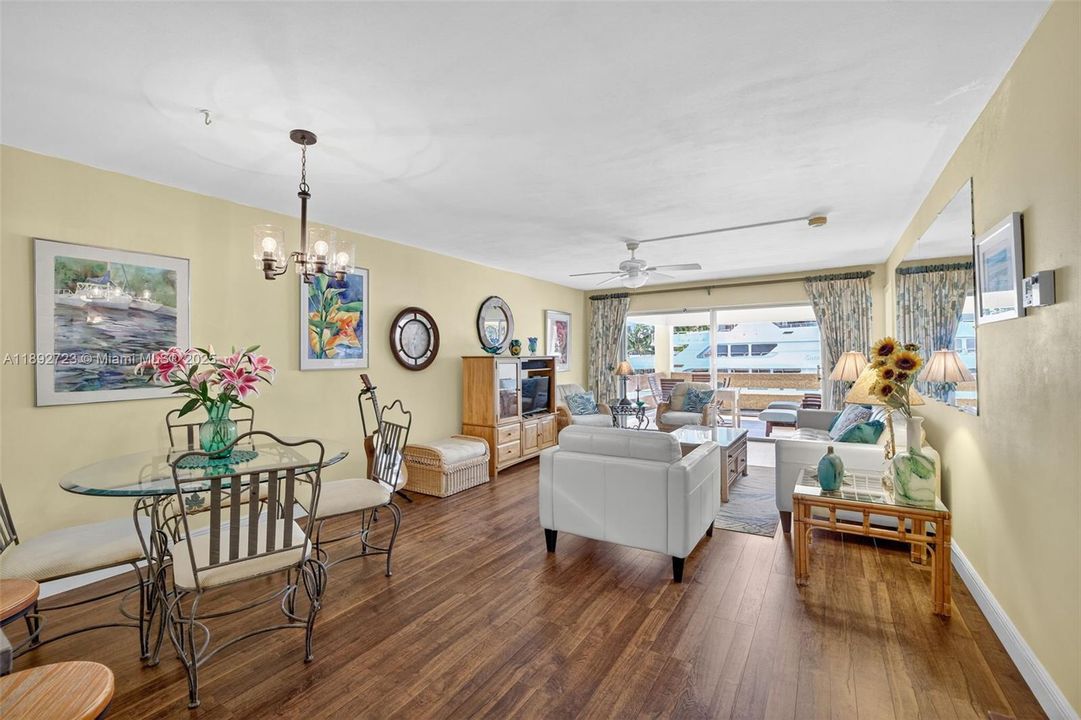 Flat ceilings and updated flooring in living areas. Bright and tropical feeling space with a view straight out to a mega yacht