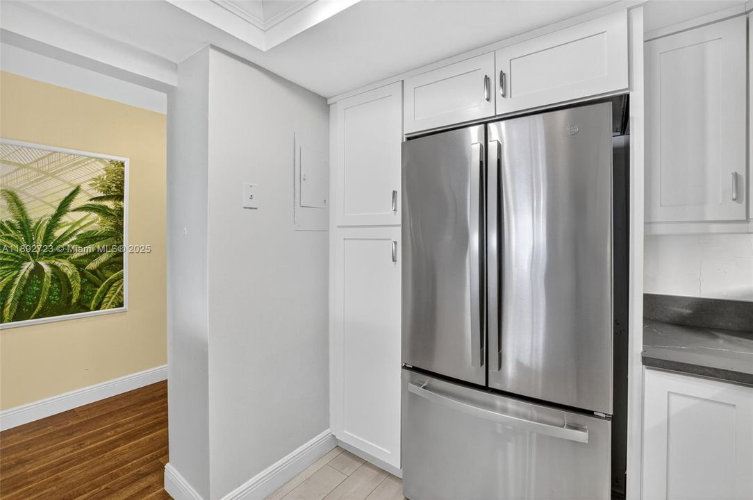 Check out the newly updated kitchen - w/ sleek cabinets w/ pullouts and premium counters and stainless appliances