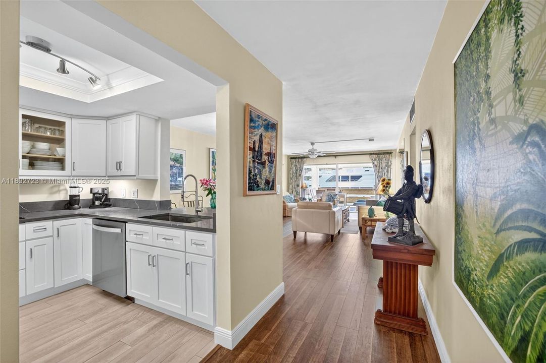 Foyer entrance with updated kitchen and flooring in living areas