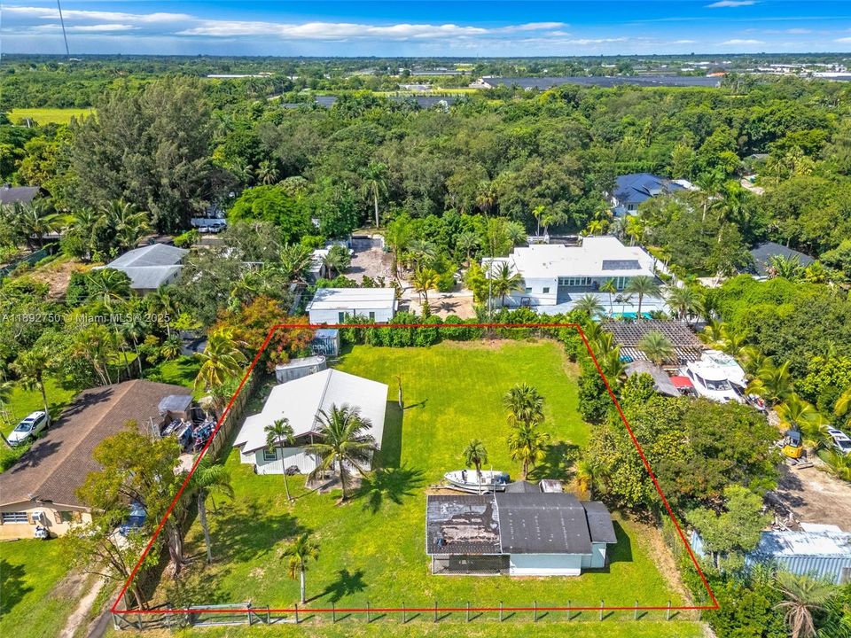 1/4 ACRE AERIAL VIEW W/ DETACHED GARAGE/WORKSHOP.