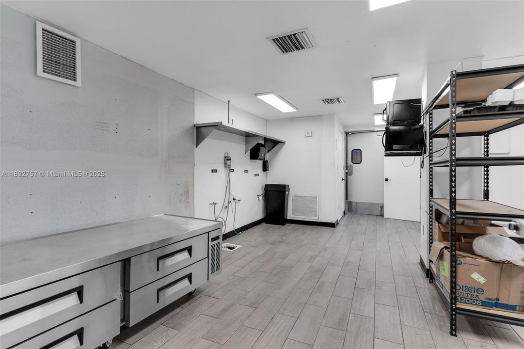 BACK ROOM STORAGE AND PREPARATION AREA W/ OFFICE