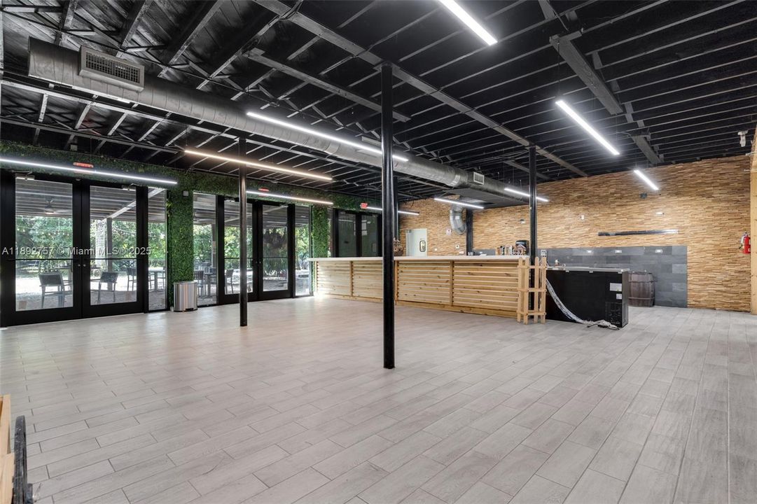 NTERIOR OF THE SHOP WITH COUNTRY VIBE LARGE OPEN SHOWROOM, KITCHEN, CUSTOM LIGHTING AND EQUIPMENT