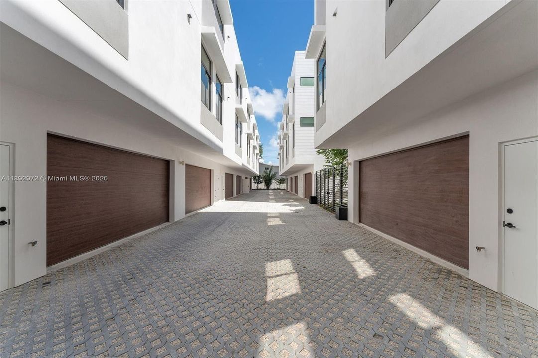 MASSIVE 2 CAR GARAGE WITH TANKLESS HWH & STORAGE AND ROOM FOR WALL OF BUIULT-IN CABINETS.