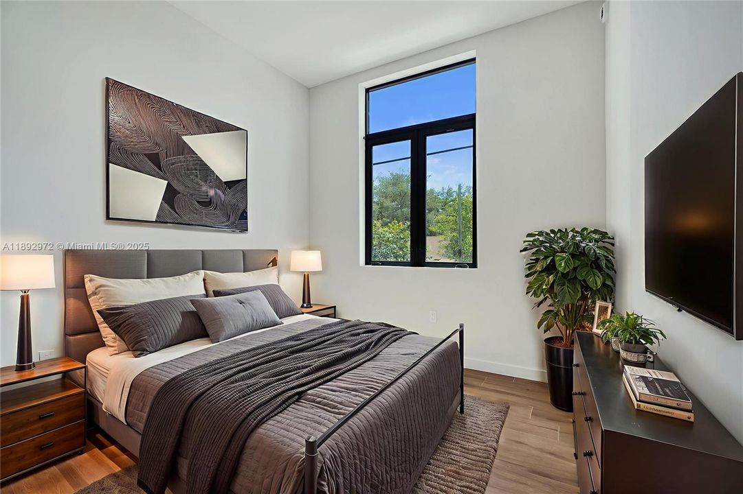 PRIMARY WITH PICTURESQUE CUT-OUT WINDOWS, DOUDLE SINKS, WALK IN CLOSETS.