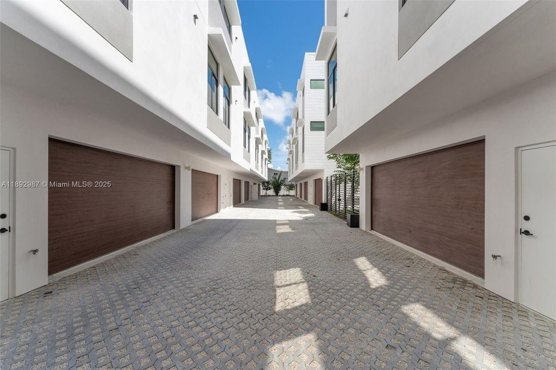 MASSIVE 2 CAR GARAGE WITH TANKLESS HWH & STORAGE AND ROOM FOR WALL OF BUIULT-IN CABINETS.