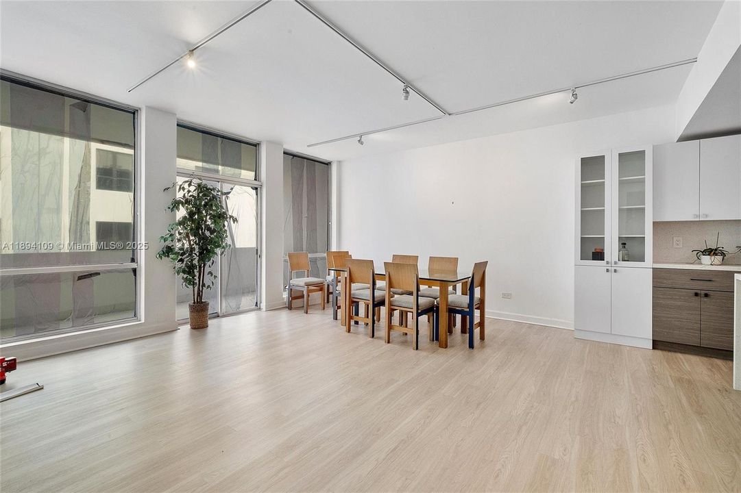 This photo shows the view of the Living room- dining area. Open floorplan and lots of natural light.