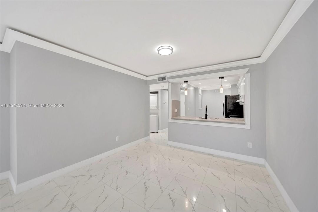 The layout easily fits a full living area plus dining, and you can see straight into the kitchen, which makes entertaining super easy.