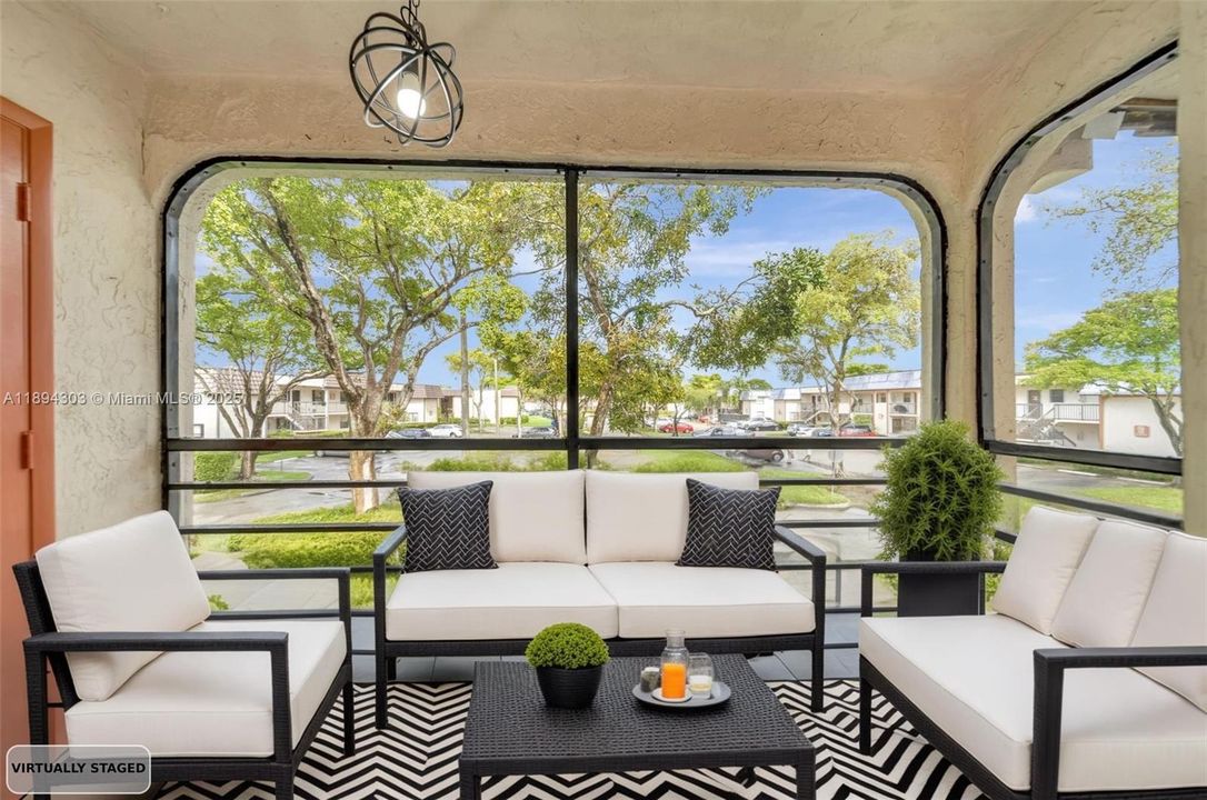 This private, enclosed patio extends your living space outdoors — perfect for morning coffee or evening wine. Surrounded by greenery and refreshed with modern lighting, it’s an ideal spot to relax, entertain, and enjoy the breeze without the bugs.