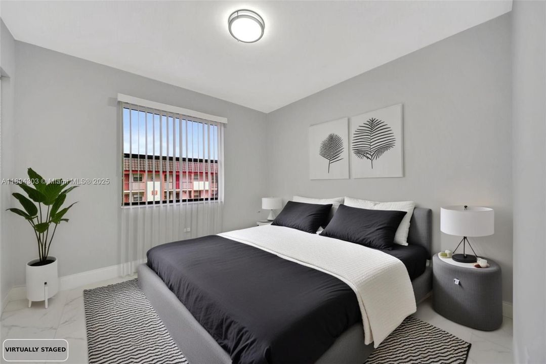 Bright and newly refreshed bedroom featuring polished marble-look tile flooring, modern recessed-style lighting, new blinds, and clean light-gray paint with upgraded baseboards. A sleek, move-in ready space with a contemporary feel.