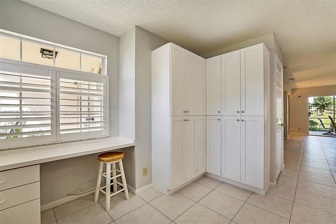 Great space for your office pleanty of storage cabinets . built in desk