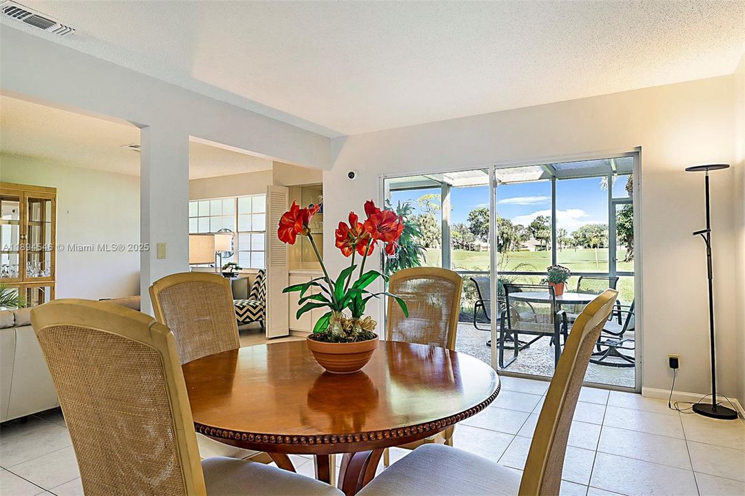 Relax in the dining area with sweeping views of the golf course.