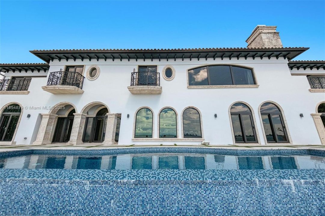 Mediterranean arches above a sapphire pool