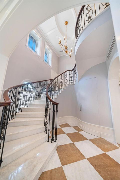 Architectural staircase to the private suites