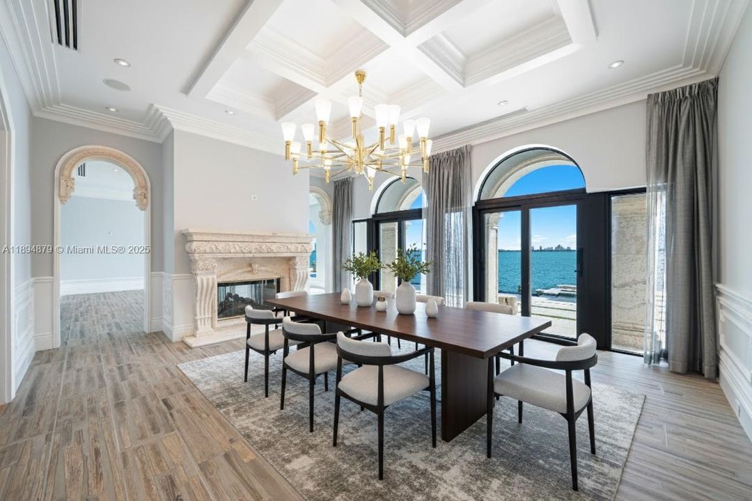 Virtually staged dining room, opens to waterfront deck