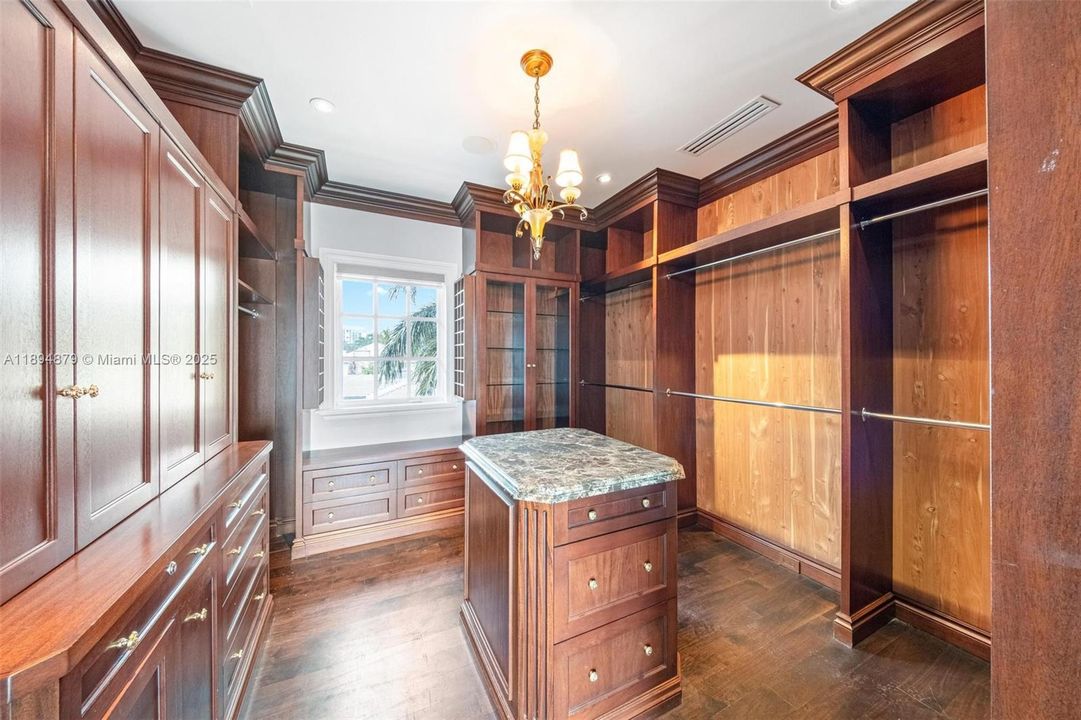 Two oversized cedar wood walk-in closets off the primary bath, each with center island