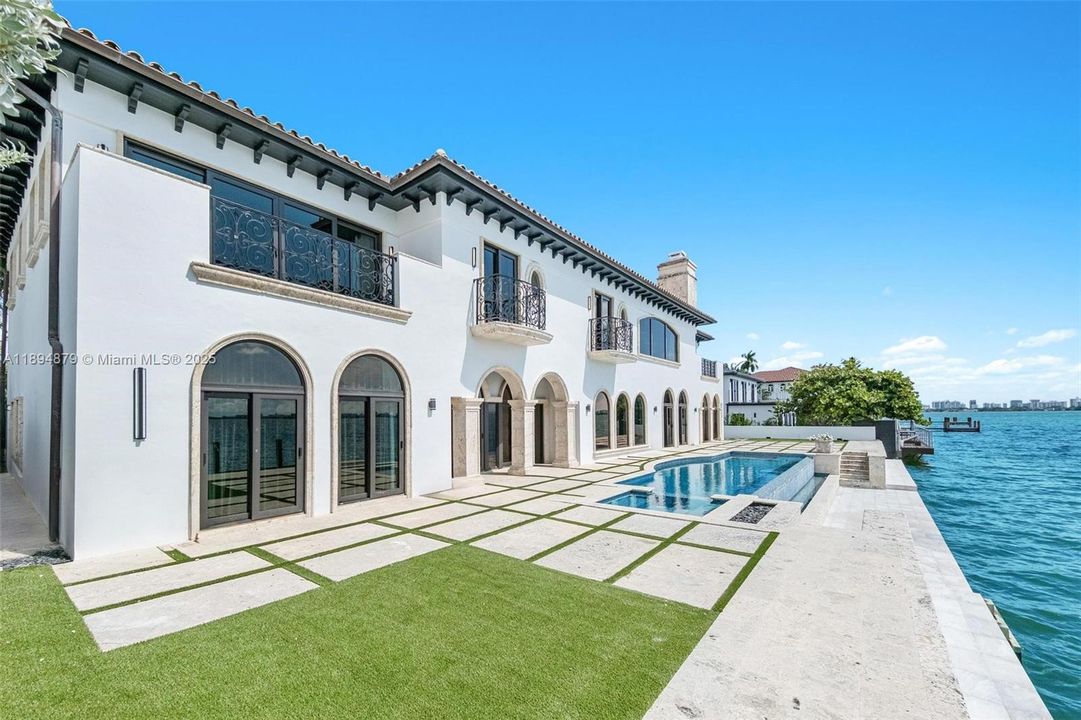 Expansive south-facing waterfront terrace with pool & spa