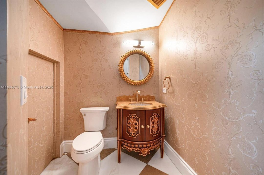 Guest powder room under the grand staircase