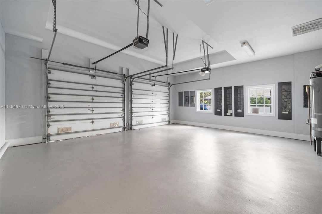 Side-entry oversized 2-car garage + extra gated driveway spaces