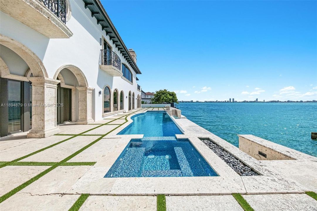 Infinity lap pool, spa and fire pit on the open bay