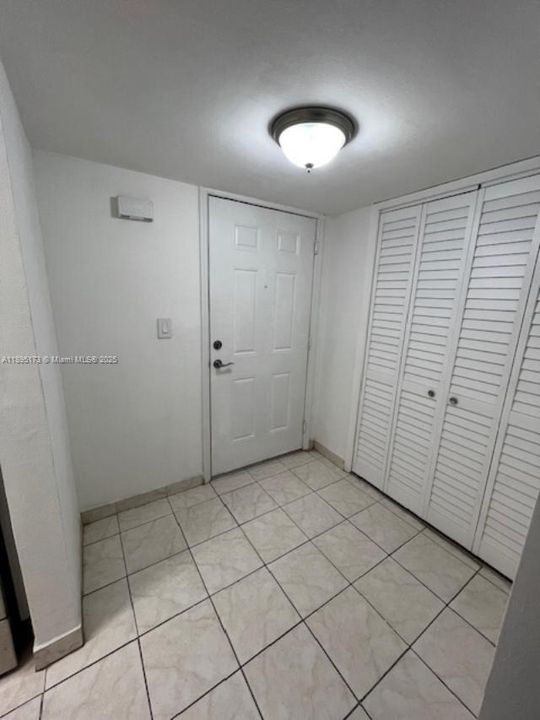 FOYER ENTRANCE WITH EXTRA STORAGE CLOSET