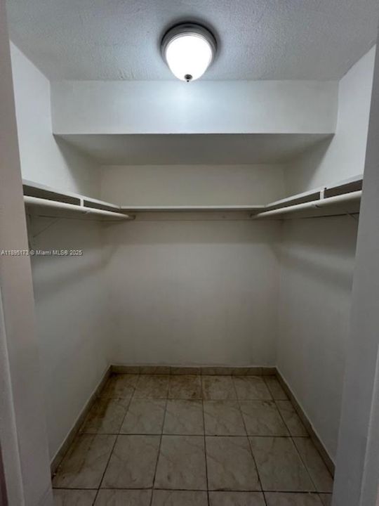 LARGE WALK IN CLOSET IN MASTER BEDROOM