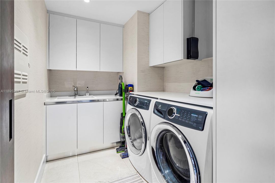 Laundry room with utility sink & storage