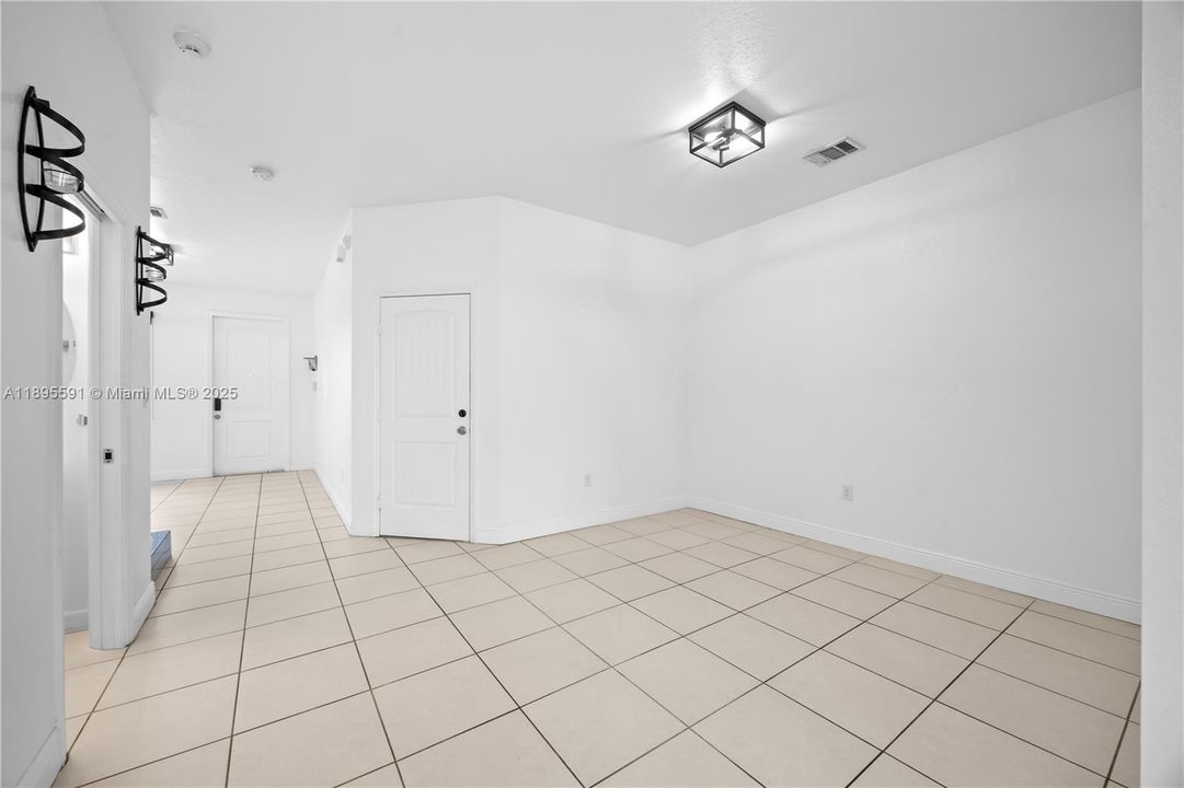 LIVING ROOM AREA/ ACCESS TO GARAGE