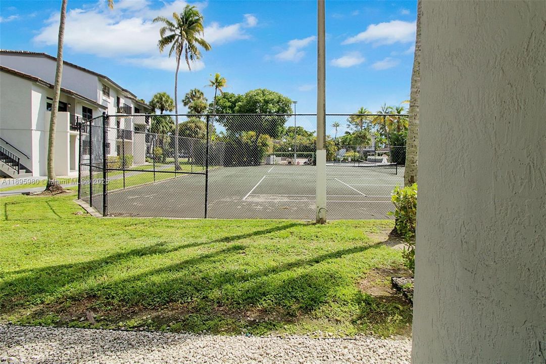 View of tennis courts from unit's patio.