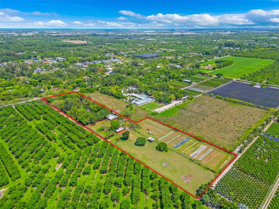 AERIAL VIEW OF THE GROUNDS   THE CANOPY HIDES THE HOME. LG. CENTER AISLE BARN W/ SM PADDOCK. AN OPEN AIR 3 STALLS HAS LG PASTURE ON NW SIDE W/ LEAN TOO. INSIDE PASTURE USED FOR THE ORGANIC GARDENS ARE ON SW CORNER WHERE LAND JUTS OUT. MULTIPLE ENTRANCES OFF PRIVATE ROAD WITH SERVICE ENTRANCE TO STABLES IN REAR FOR FEED DELIVERY .