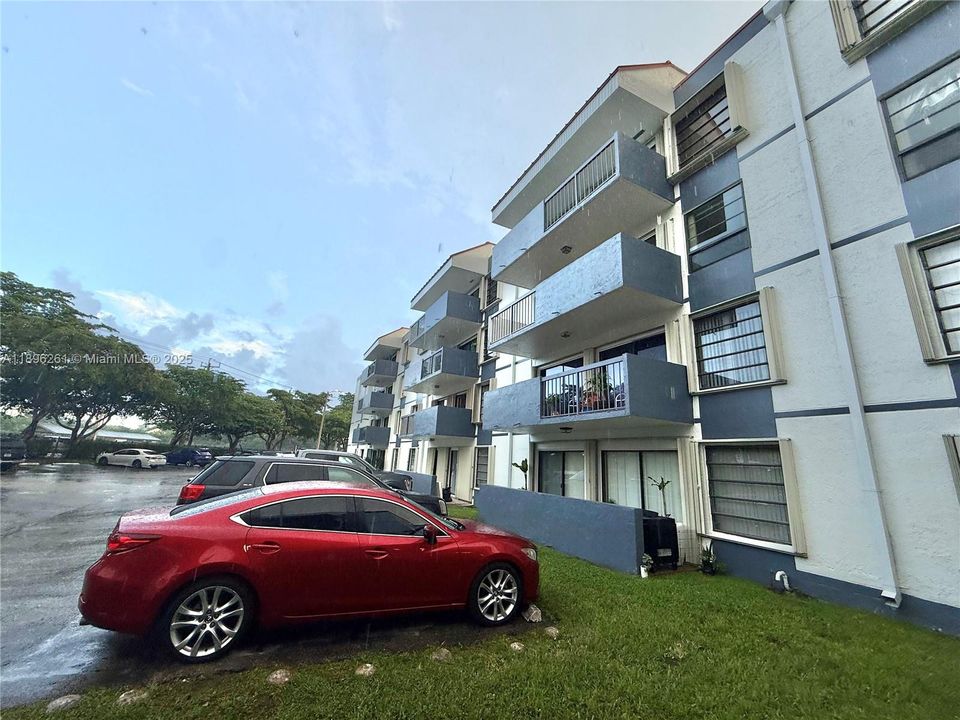 Current building, recently painted.  Unit #3406 is top floor middle unit in picture