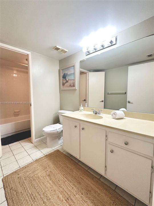 GUEST HALF BATHROOM WITH ENTRANCE TO BATH TUB SHOWER ROOM